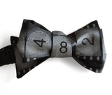 black movie film leader bow tie