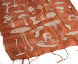  Ivory-cream ink on cinnamon silk scarf.