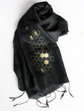 Gold ink on black silk scarf.