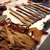 Perforated Automotive Leather Bow Ties in process.