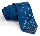 Pill Spill necktie. Dove gray print on french blue.