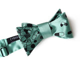 Pill Spill bow tie: Black on mint.