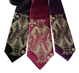 Antique brass ink on black, spiced wine, eggplant silk.