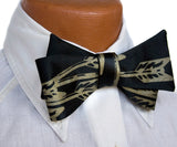 Antique brass ink on a black bow tie.