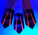 Raving Laser Kitten Neckties under blacklight. Black and glow red on light pink, white, pink.