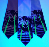 Raving Laser Kittne Ties under blacklight: glow green on seafoam, sky blue, aqua.