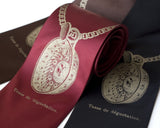 Tastevin Necktie. Antique brass ink on burgundy.