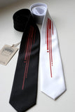 Red ink on black, white narrow tie.