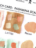 Pashmina swatches with printing ink samples applied and beside.