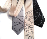 Track Map silk tie: black pearl on silver, cream, black.