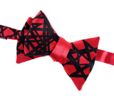 Black ink on red bow tie.