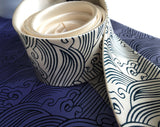 detail of cream sea waves necktie